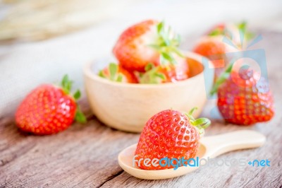 Fresh Strawberries On Old Wooden Table Stock Photo