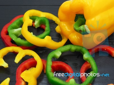 Fresh Vegetables, Red, Yellow, Green Sweet Peppers On Dark Wood Stock Photo