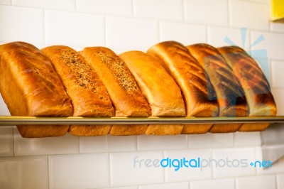 Freshly Kneaded Grain And White Breads For Sale Stock Photo