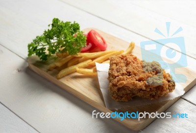 Fried Chicken With Fries On A Plate Stock Photo