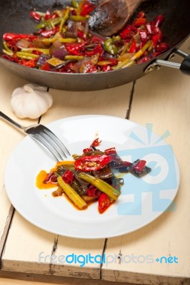 Fried Chili Pepper And Vegetable On A Wok Pan Stock Photo