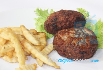 Fried Meatball With French Fries And Salad Stock Photo