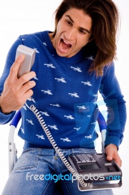 Front View Of Angry Man Shouting On Phone Stock Photo