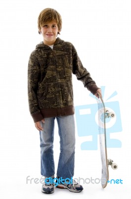 Front View Of Boy Holding Skate Stock Photo