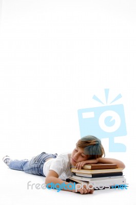 Front View Of Boy Sleeping On Books Stock Photo