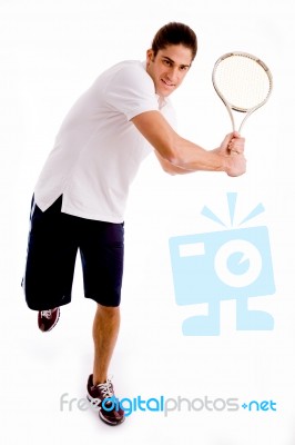 Front View Of Man Playing Tennis Stock Photo