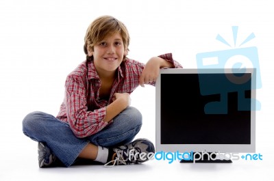 Front View Of Sitting Boy With Lcd Screen Stock Photo