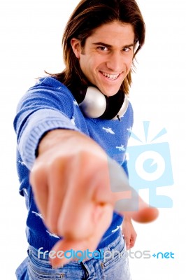 Front View Of Smiling Man Pointing Stock Photo