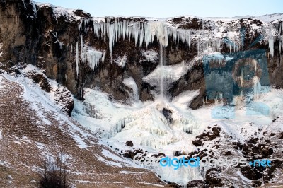 Frozen Waterfall Near Vik Iceland Stock Photo