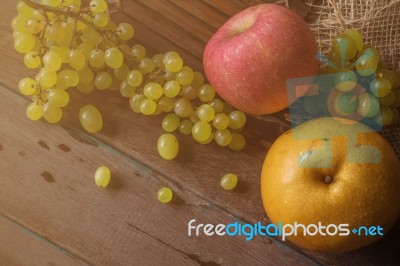 Fruits On Wooden Floor Stock Photo