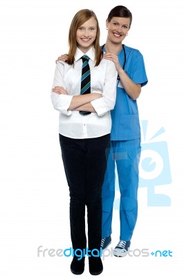 Full Length Portrait Of A Doctor With Her Patient Stock Photo