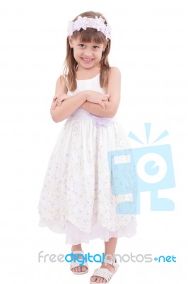 Full Length Portrait Of A Little Girl Standing With Folded Hands… Stock Photo