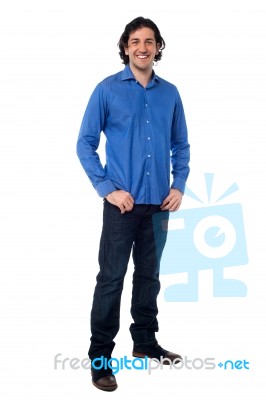 Full Length Shot Of A Smiling Young Man Stock Photo