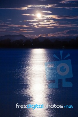 Full Moon Shining Down On The River Stock Photo