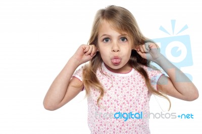 Fun Loving Girl Child Making Faces Stock Photo