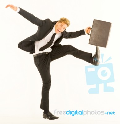 funny Businessman dancing with case Stock Photo