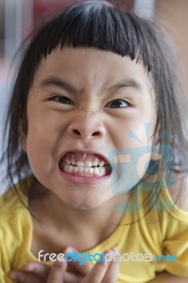 Funny Face Of Asian Children Grin ,toothy Face Stock Photo