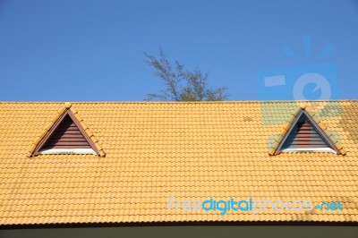 Gable On The Yellow Roof Look Like Smiling Eyes Stock Photo