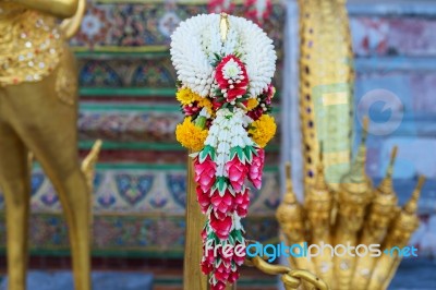 Garland To Worship Buddha Statue Stock Photo