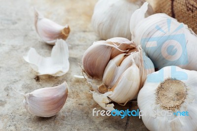 Garlic On Cement Floor Stock Photo