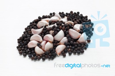 Garlic With  Peppercorn Isolated On White  Stock Photo