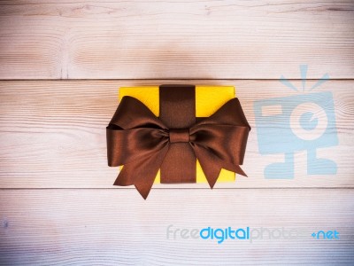 Gift Box On The Wooden Board Stock Photo