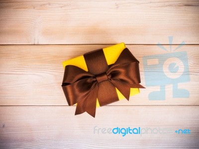 Gift Box On The Wooden Board Stock Photo