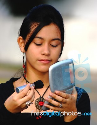 Girl Applying Blusher Stock Photo