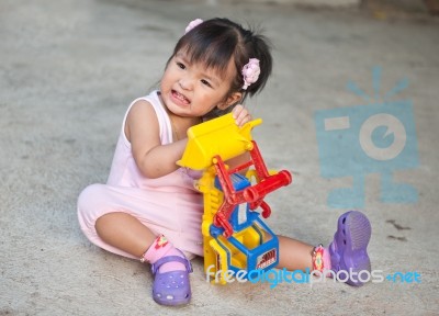 Girl Baby Playing Toy Stock Photo