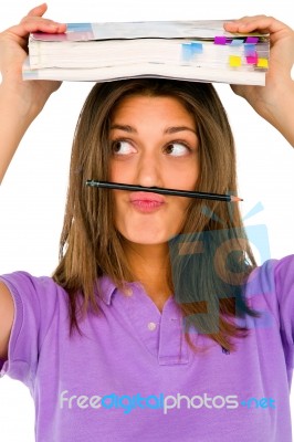 Girl Balancing Pencil On Her Lip Stock Photo