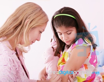Girl Being Injected Stock Photo