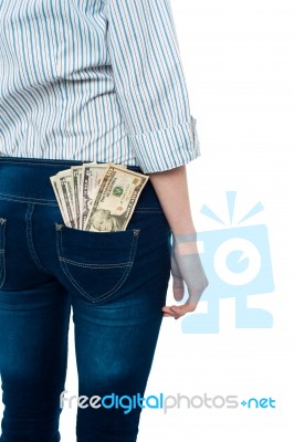 Girl Carrying Dollars In Back Pocket Stock Photo