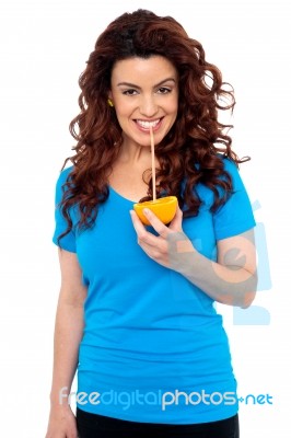 Girl Drinking Orange Juice Stock Photo