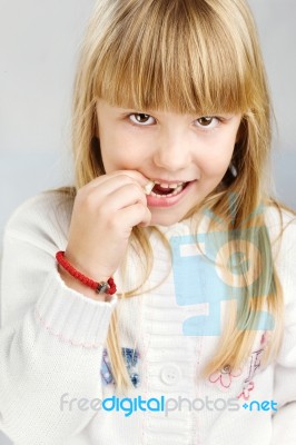 Girl Eating Candy Stock Photo