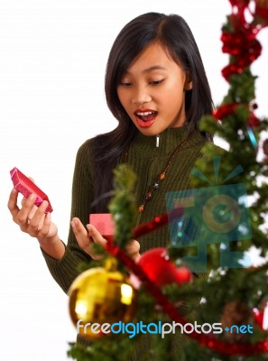 Girl Excited By Her Christmas Gift Stock Photo