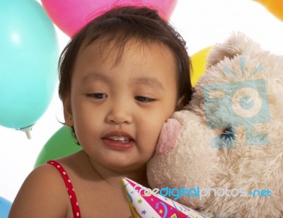 Girl Getting Kiss From Teddy Bear Stock Photo