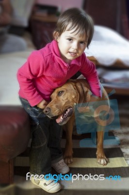 Girl Hugging Her Dog Stock Photo
