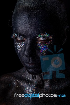 Girl In Black Makeup With Sparkles Stock Photo