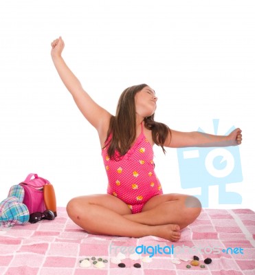 Girl In Swimsuit At The Beach Relaxing Stock Photo