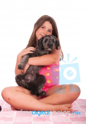 Girl In Swimsuit At The Beach With Dog Stock Photo