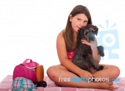 Girl In Swimsuit At The Beach With Dog Stock Photo