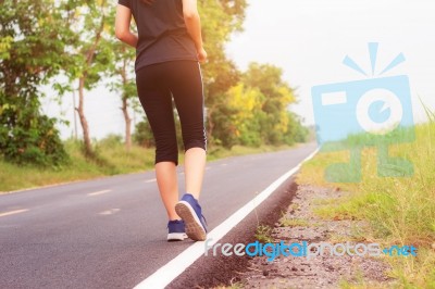 Girl Is Jogging On Street Stock Photo