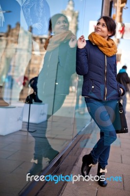 Girl Is Looking At Shop Window Stock Photo