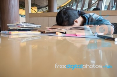 Girl Is Tired Of Reading Books, Decided To Relax With His Head R… Stock Photo