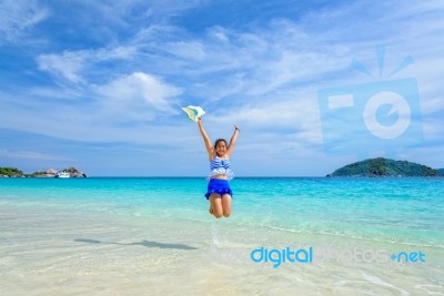 Girl Jumping With Happy On The Beach At Thailand Stock Photo