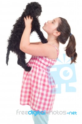 Girl Kissing Dog Stock Photo