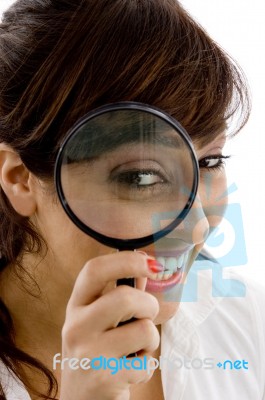 Girl Looking Through Magnifier Stock Photo