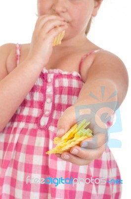 Girl Offering Chips Stock Photo