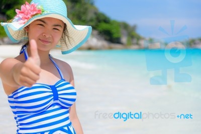 Girl On The Beach At Thailand Stock Photo