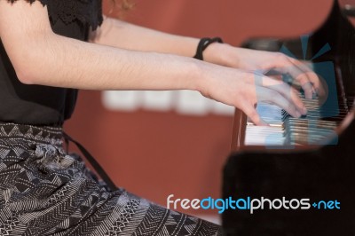 Girl Plays Piano Stock Photo